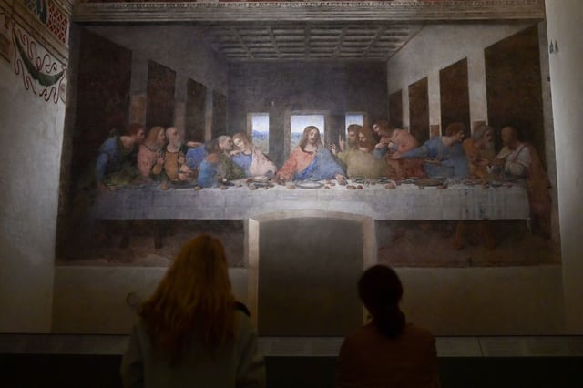 Visitors watch “The Last Supper” (Il Cenacolo or L’Ultima Cena), Italian artist Leonardo da Vinci’s late 15th-century mural painting housed by the refectory of the Convent of Santa Maria delle Grazie in Milan, on February 10, 202 (Photo by MIGUEL MEDINA/AFP via Getty Images)