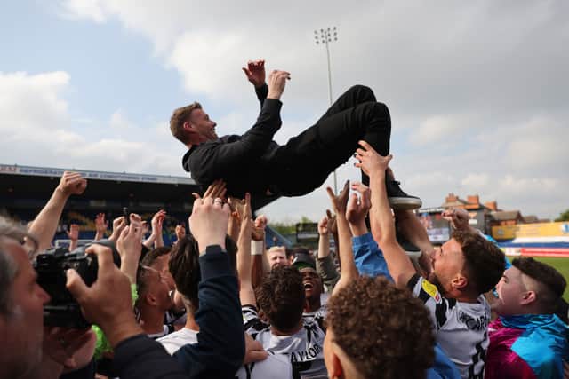 Rob Edwards celebrates with Forest Green Rovers after promotion to League One 