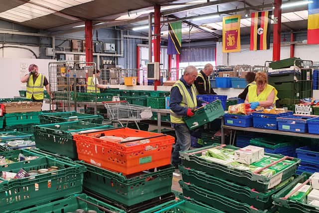 Volunteers helping out in the Halo Centre, Coventry Foodbank. 