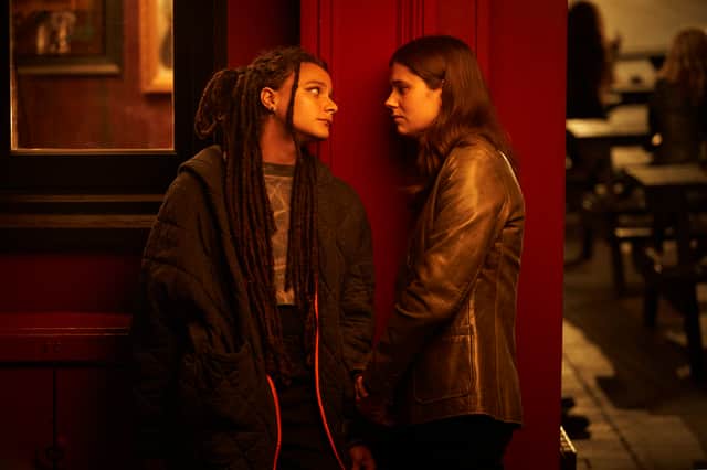 Alison Oliver as Frances and Sasha Lane as Bobbi, stood staring at each other in a smoking garden (Credit: BBC/Element Pictures/Enda Bowe)