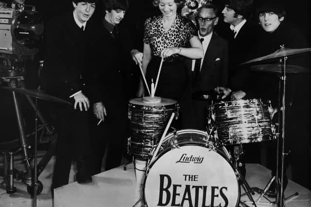 Wilfred Brambell with fashion designer Julie Harris and The Beatles during production of A Hard Day’s Night