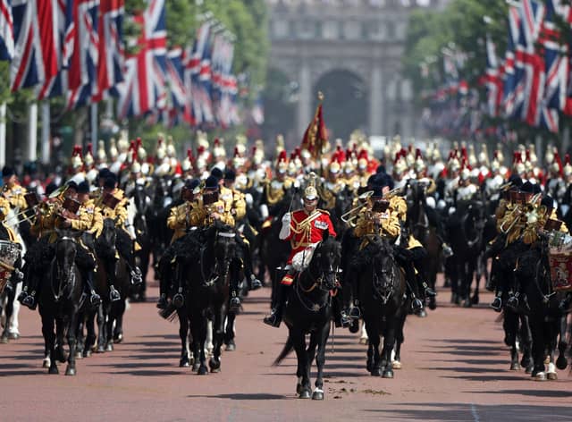 The mounted band marches down The Mall after attending the Queen’s Birthday Parade, ‘Trooping the Colour’ on Horseguards parade in London.