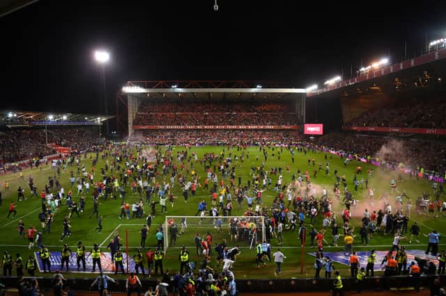  Notts Forest fans invade the pitch after beating Sheffield United at the City Ground (Photo: Michael Regan/Getty Images)