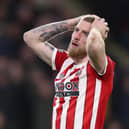 Oli McBurnie  reacts after a missed chance during a match between Sheffield United and Hull City in February 2022 (Photo: George Wood/Getty Images)