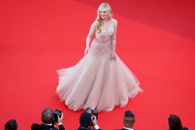 Elle Fanning attends the screening of "Top Gun: Maverick" during the 75th annual Cannes film festival at Palais des Festivals on May 18, 2022 in Cannes, France. 
