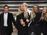 Amber Heard and her sister Whitney at the libel trial in London (Pic: AFP via Getty Images)