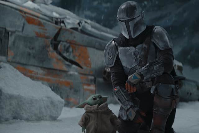 The Mandalorian and his little buddy Baby Yoda (Credit: Lucasfilm)