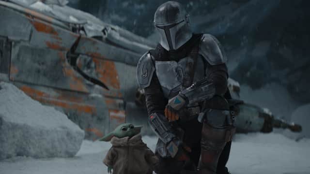 The Mandalorian and his little buddy Baby Yoda (Credit: Lucasfilm)
