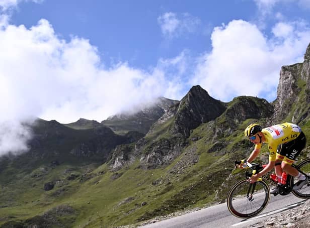 <p>Team UAE Emirates’ Tadej Pogacar of Slovenia wearing the overall leader’s yellow jersey descends the Tourmalet pass during the 2021 Tour de France (Photo: ANNE-CHRISTINE POUJOULAT/AFP via Getty Images)</p>