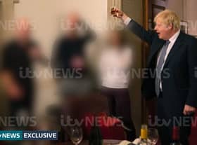 In pictures obtained by ITV News, Boris Johnson can be seen toasting a drink at an illegal gathering, for which he was not fined by the Met Police. (Credit: ITV)