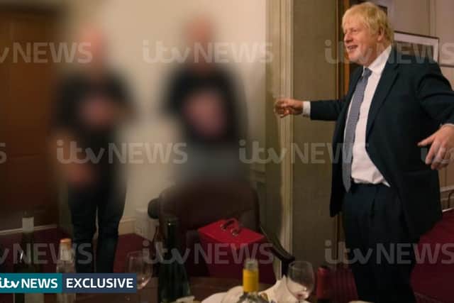Boris Johnson raises a glass at the illegal gathering which took place on 13 November 2020. (Credit: ITV News)