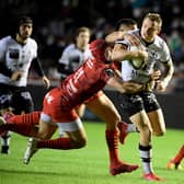 Lyon’s New Zealand full back Toby Arnold is tackled during the French Top 14 rugby union match between Toulon and Lyon (Photo by NICOLAS TUCAT/AFP via Getty Images)