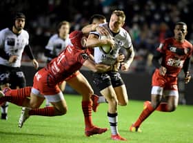Lyon’s New Zealand full back Toby Arnold is tackled during the French Top 14 rugby union match between Toulon and Lyon (Photo by NICOLAS TUCAT/AFP via Getty Images)