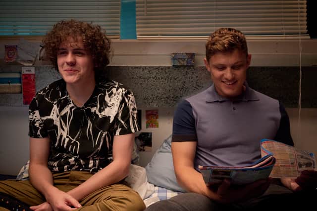 Dylan Llewellyn as Jack Rooke, listening to Danny (Jon Pointing) reading the TV guide after a disaster night out (Credit: Channel 4)
