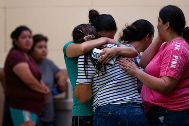People mourn outside of the SSGT Willie de Leon Civic Center following the mass shooting at Robb Elementary School (Photo by Brandon Bell/Getty Images)