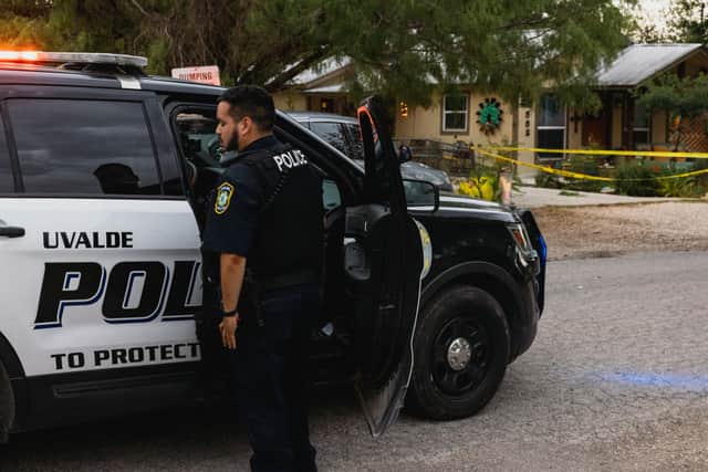 Uvalde Police gather outside the home of 18-year-old Salvador Ramos on May 24, 2022 in Uvalde, Texas (Photo by Jordan Vonderhaar/Getty Images)