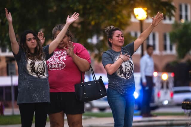 People become emotional at the City of Uvalde Town Square during a prayer vigil in the wake of a mass shooting at Robb Elementary School on May 24, 2022 in Uvalde, Texas (Photo by Jordan Vonderhaar/Getty Images)