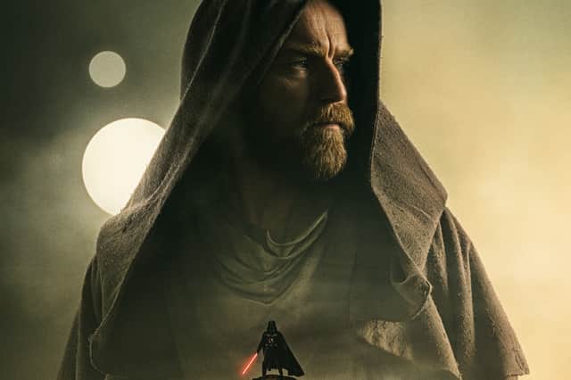 Ewan McGregor as Obi-Wan Kenobi, his hood pulled close to his face, staring to his right (Credit: Lucasfilm)