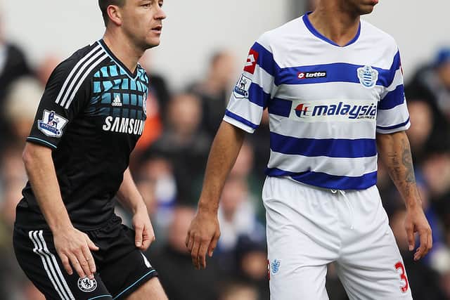 John Terry of Chelsea prepares to defend a corner with Anton Ferdinand of Queens Park Rangers during the FA Cup with Budweiser Fourth Round match between Queens Park Rangers and Chelsea at Loftus Road on January 28, 2012 in London, England (Photo by Clive Mason/Getty Images)