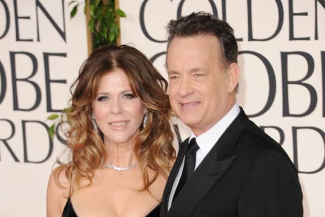 Rita Wilson and actor/producer Tom Hanks arrive at the 68th Annual Golden Globe Awards held at The Beverly Hilton hotel on January 16, 2011 in Beverly Hills, California (Photo by Jason Merritt/Getty Images)