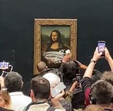 The man spread cake icing on the protective glass surface of the Mona Lisa. (Credit: PA)