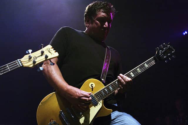 Sex Pistols guitarist Steve Jones performing  onstage at The Ramones 30th Anniversary Party in 2004 (Photo: Amanda Edwards/Getty Images)
