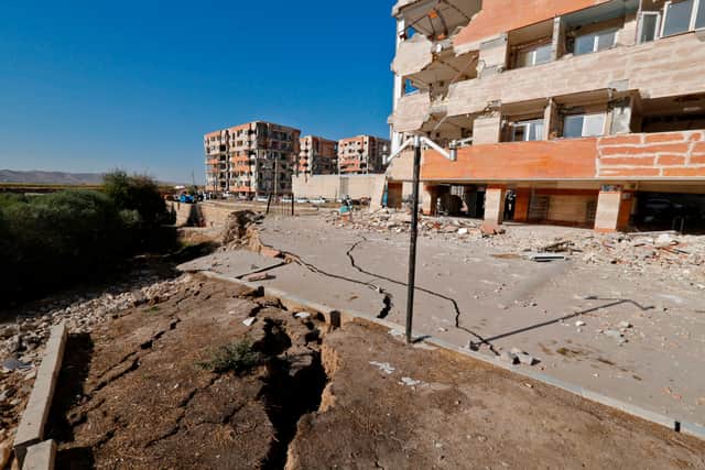 An earthquake causes damage to buildings and the ground after a 7.3 magnitude earthquake in Iran (Pic: AFP via Getty Images)