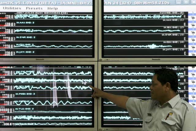 A meteorologist points to a graph measuring an earthquake which struck North Sulawesi in 2007 (Pic: Getty Images)
