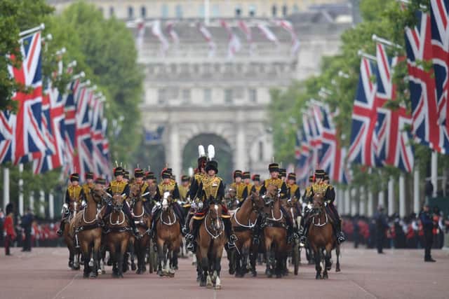 Members of The King’s Troop Royal Artillery lead the parade down the Mall back to Buckingham Palace after the Queen’s Birthday Parade (Photo by DANIEL LEAL/AFP via Getty Images)