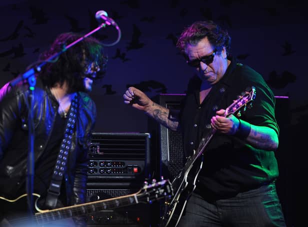 Steve Jones (right) has continued to play live regularly after finding fame in The Sex Pistols. (Credit: Getty Images)
