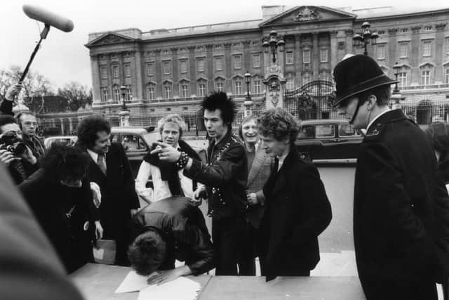 The Sex Pistols outside Buckingham Palace in 1977 (Pic: Getty Images)