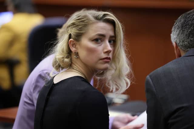 Amber Heard hears the result of the libel case against her ex-husband Johnny Depp (image: AFP/Getty Images)