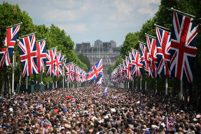 Members of the public fill the Mall before a flypast during the Trooping the Colour ceremony