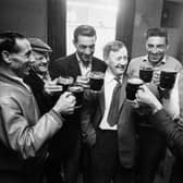 A group of men enjoying a pint at the local in 1963 (Reg Lancaster/Express/Getty Images)