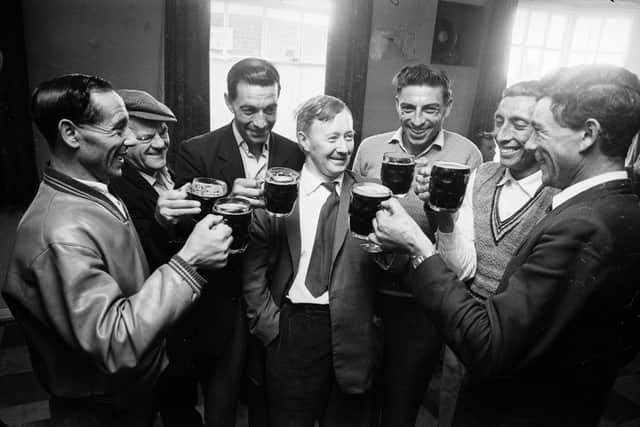 A group of men enjoying a pint at the local in 1963 (Reg Lancaster/Express/Getty Images)