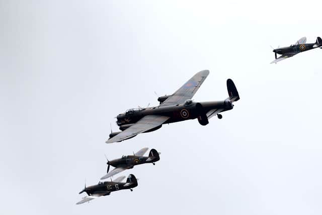  Image shows two Hurricanes (bottom), a Spitfire (top) and an Avro Lancaster bomber from the Battle of Britain Memorial Flight during a display over RAF Coningsby in Lincolnshire, to mark the Battle of Britain Memorial Flight’s 60th anniversary.