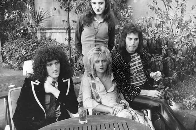 September 1976:  British rock group Queen at Les Ambassadeurs, where they were presented with silver, gold and platinum discs for sales in excess of one million of their hit single ‘Bohemian Rhapsody’, which was No 1 for 9 weeks (Photo by Ian Tyas/Keystone/Getty Images)