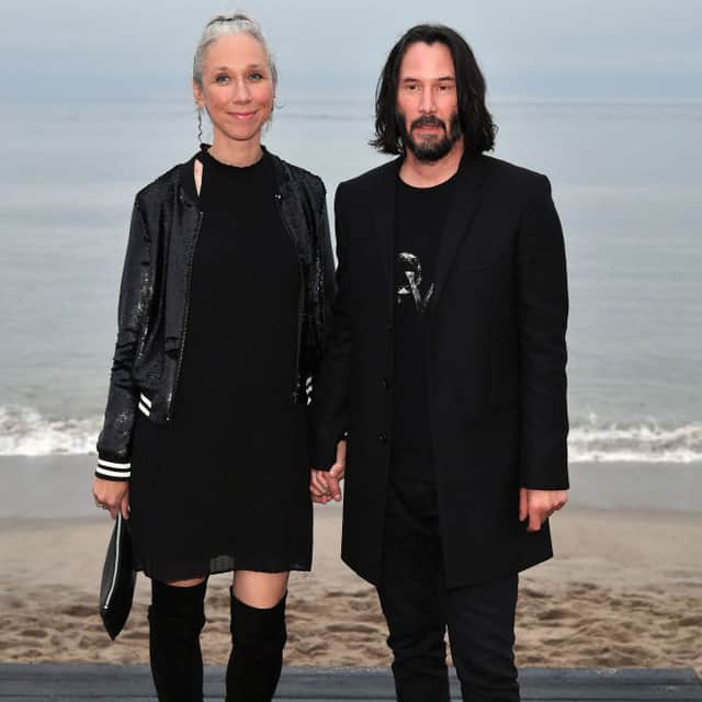Alexandra Grant and Keanu Reeves attends the Saint Laurent Mens Spring Summer 20 Show on June 06, 2019 in Paradise Cove Malibu, California (Photo by Neilson Barnard/Getty Images)
