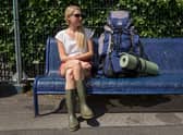 Laura, a doctor from Salisbury, waits for her friends to arrive by train at Castle Cary station for the first day of the 2014 Glastonbury Festival (Photo: Rob Stothard/Getty Images)