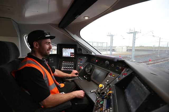 Test engineer Scott Bibby in the driver’s seat of a Hitachi Intercity Express Programme train (IEP) at Hitachi’s manufacturing plant in Newyton Aycliffe, north-east England (Photo:SCOTT HEPPELL/AFP via Getty Images)