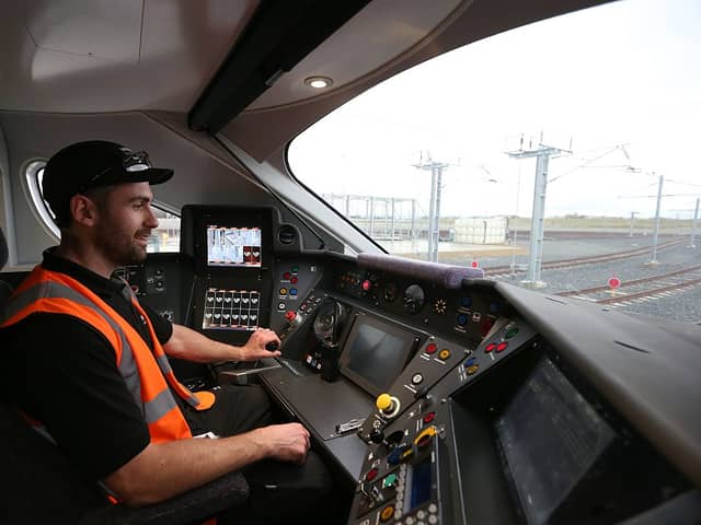 Test engineer Scott Bibby in the driver’s seat of a Hitachi Intercity Express Programme train (IEP) at Hitachi’s manufacturing plant in Newyton Aycliffe, north-east England (Photo:SCOTT HEPPELL/AFP via Getty Images)