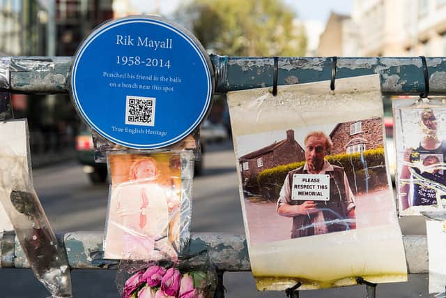 Photographs and messages of condolences on the traffic island as a memorial bench for the late Rik Mayall is unveiled on November 14, 2014 in London, England  (Photo by Ian Gavan/Getty Images)