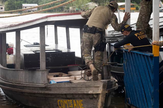 Police search a boat where blood, believing to be from the pair was discovered on 11 June (Pic: AFP via Getty Images)