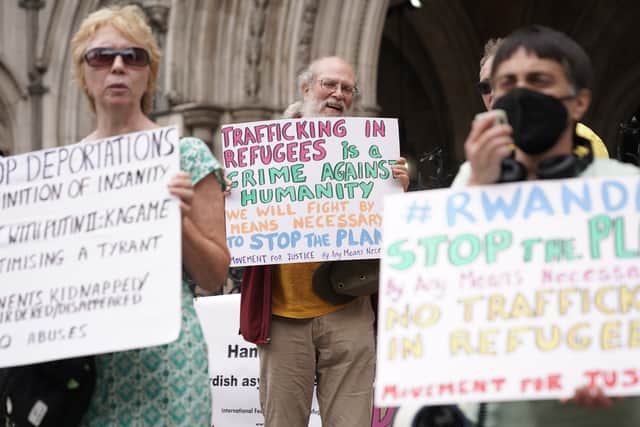 Protesters outside the High Court in London for the ruling on Rwanda deportation flights. 