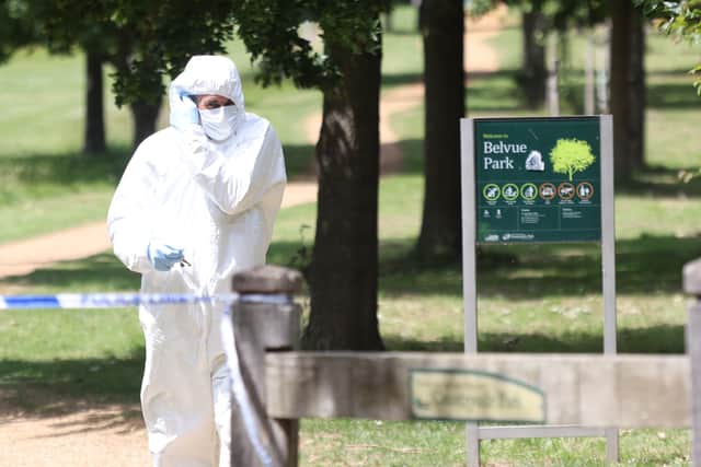 A Police forensic officer at the scene where a body was found after a fire in the early hours of this morning in Belvue Park, west London. (Credit: PA)