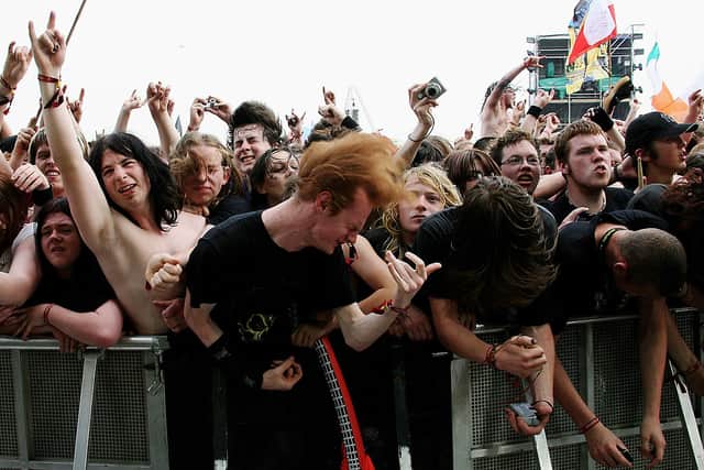 Fans in the audience enjoy Megadeth perform on the main stage during day one of the Download Festival at Donington Park on June 8, 2007 in Donington, England.  (Photo by Dave Etheridge-Barnes/Getty Images)