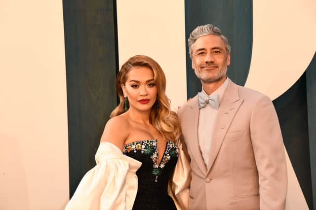 Taika Waititi and Rita Ora attend the 2022 Vanity Fair Oscar Party following the 94th Oscars at the The Wallis Annenberg Center for the Performing Arts in Beverly Hills, California on March 27, 2022 (Photo by PATRICK T. FALLON/AFP via Getty Images)