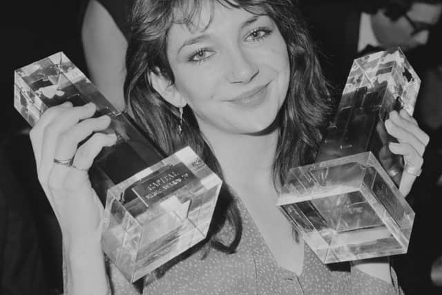 English singer/songwriter, musician, dancer and record producer Kate Bush holding her two awards for ‘Best British Female Singer’ and ‘Best British Newcomer’ at the Capital Radio Music Awards ceremony held at the Grosvenor Hotel, London, UK, 6th March 1979. (Photo by Stuart Nicol/Evening Standard/Hulton Archive/Getty Images)