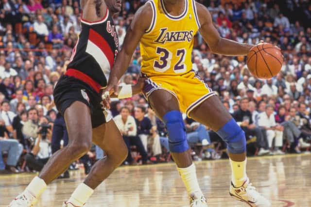 Magic Johnson for the Los Angeles Lakers (Photo by Stephen Dunn/Allsport/Getty Images)