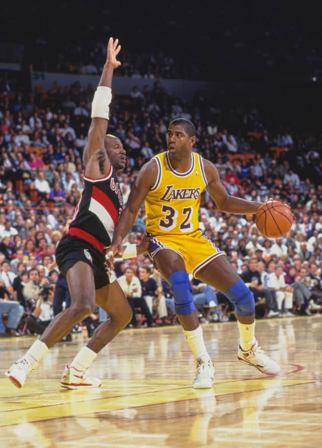 Magic Johnson for the Los Angeles Lakers (Photo by Stephen Dunn/Allsport/Getty Images)